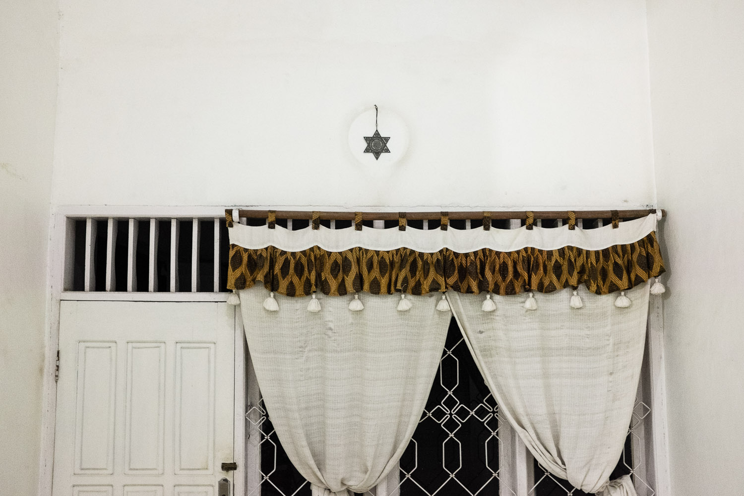   Reginal Tanalisan's house in Manado. He is an integral part of another Jewish group in Manado that is suspected of still having ties to the Church, although he continuously denies this fact and proudly displays Jewish elements and decorations in hi