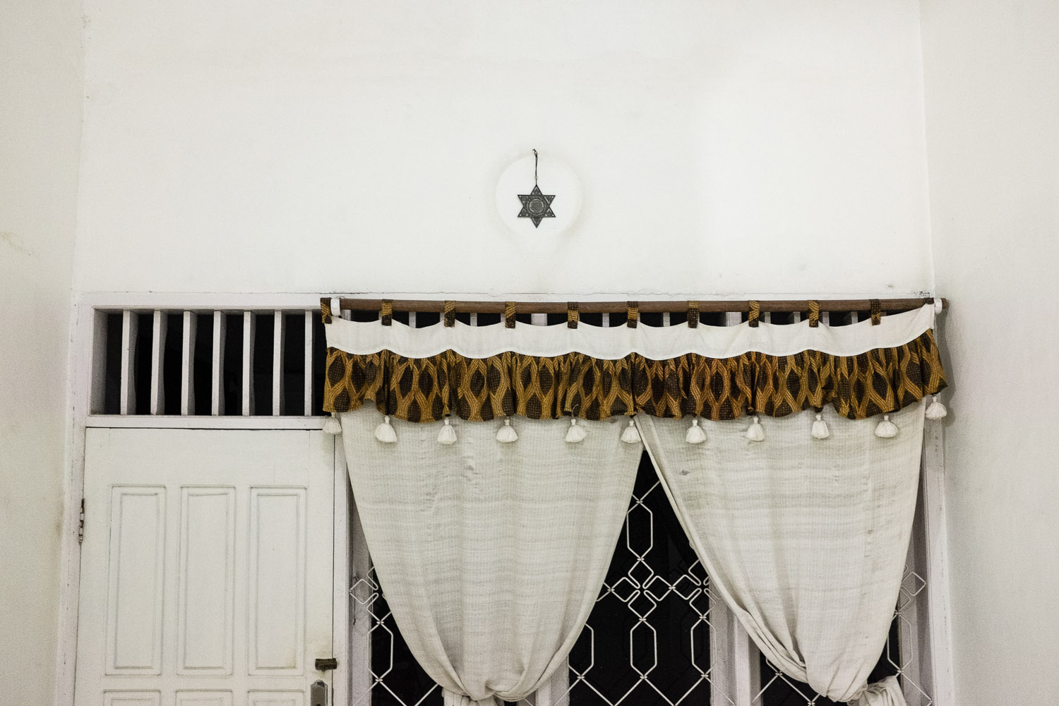 Reginal Tanalisan's house in Manado. He is an integral part of another Jewish group in Manado that is suspected of still having ties to the Church, although he continuously denies this fact and proudly displays Jewish elements and decorations in his house.