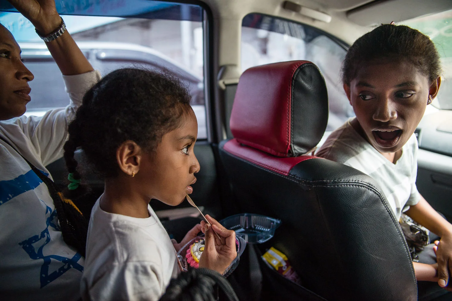 Jewish learning is an all-hands-on-deck exercise in the Hokouoku household, especially because there is no official Jewish education in Indonesia. Here, Diane's eldest daugther Venezuella reminds the youngest, Shulamith, to say the correct Bracha (prayer) before eating her Hello Kitty cupcake.