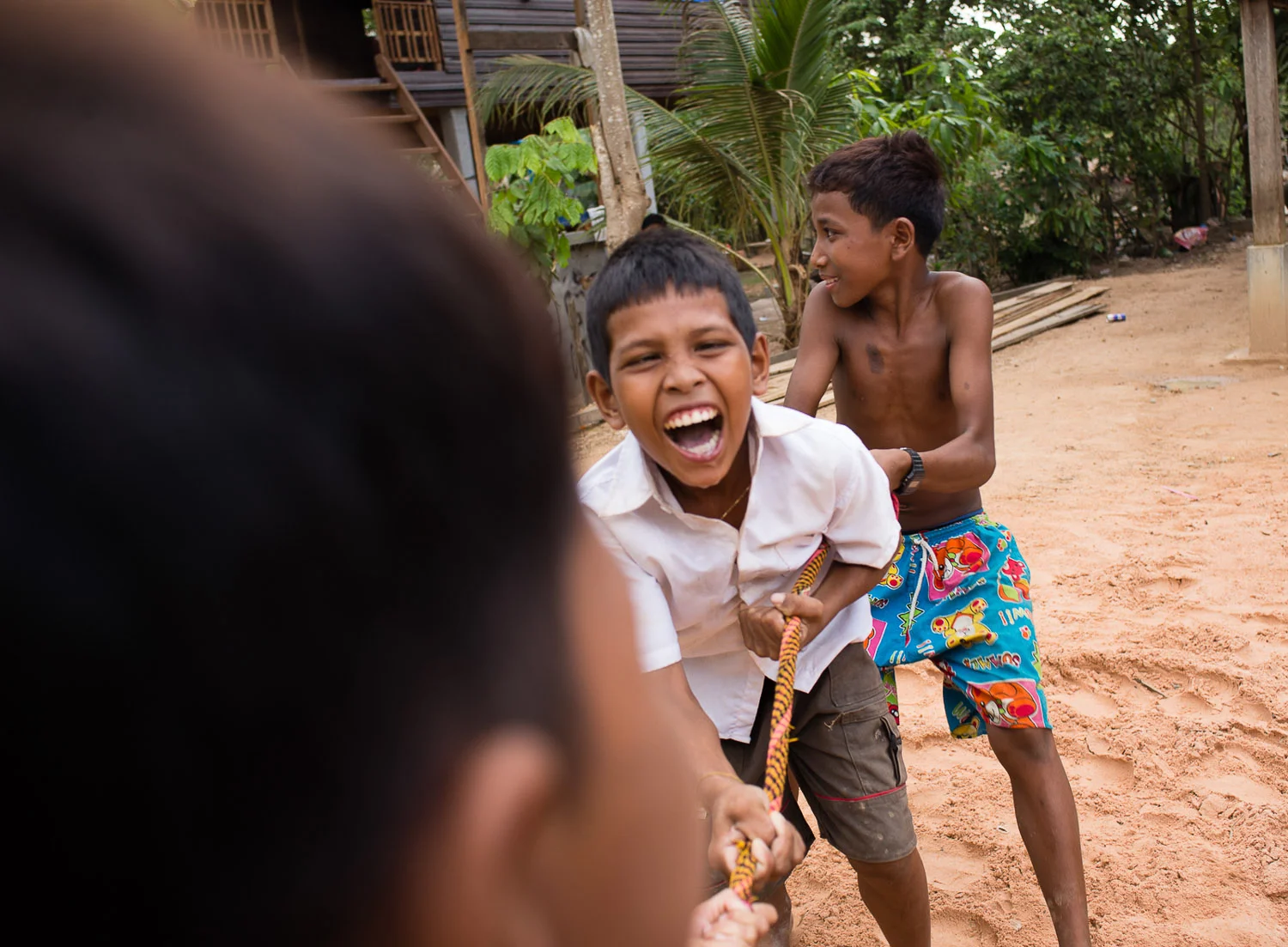 Ouk Lin plays with his neighbors.