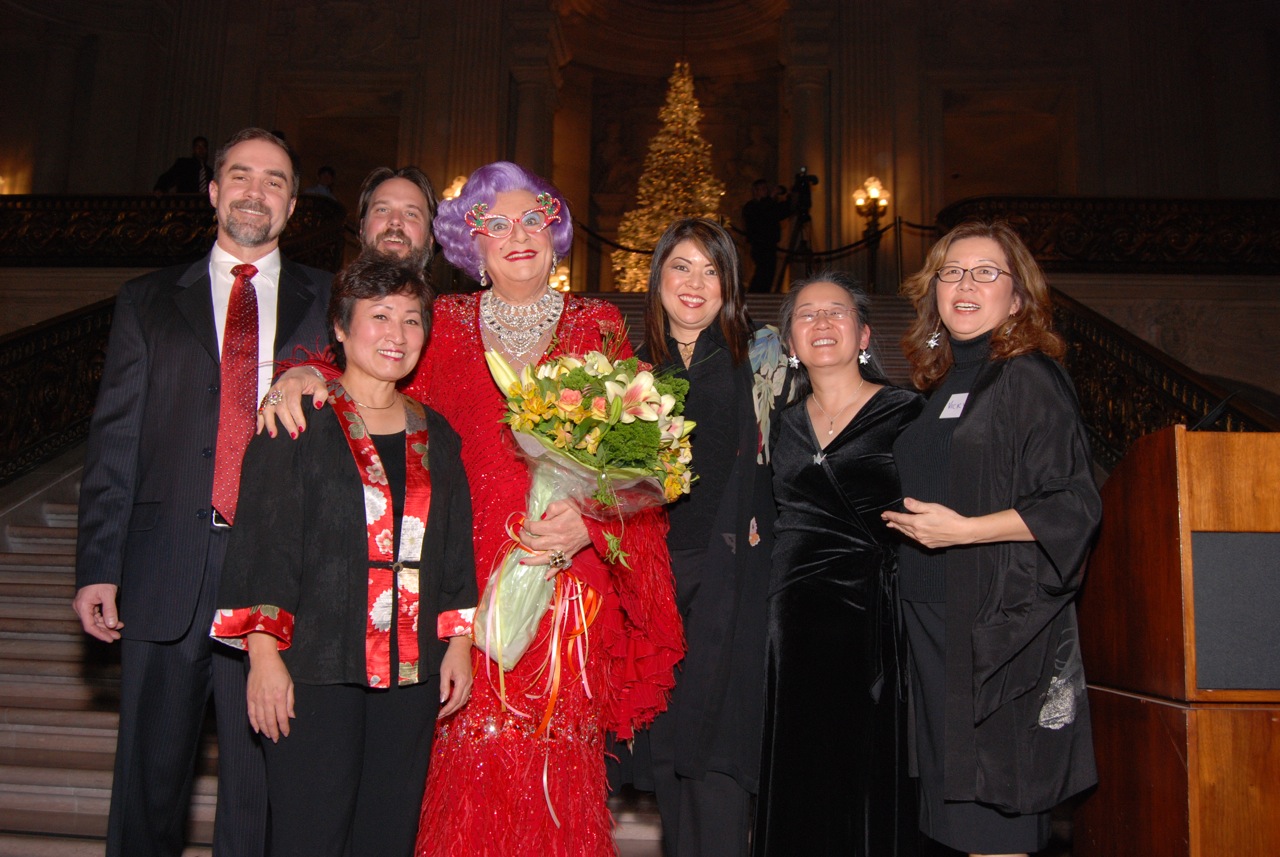 Dame Edna Everage with the tree's creators after she light the 2008 RWF World Tree of hope