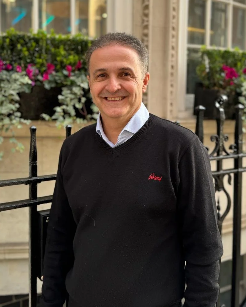 Dr Arash Zaker Shahrak standing infront of the ndu clinic in 22 Harley street, London