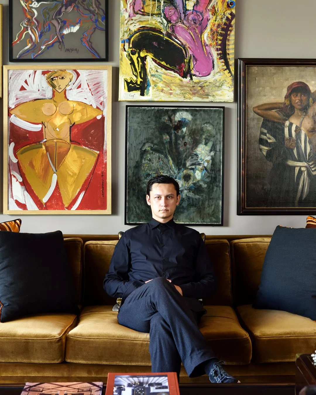 Cagil Kai Akchurin sitting on-site in a Los Angeles residential project, overseeing luxury staging and spatial composition