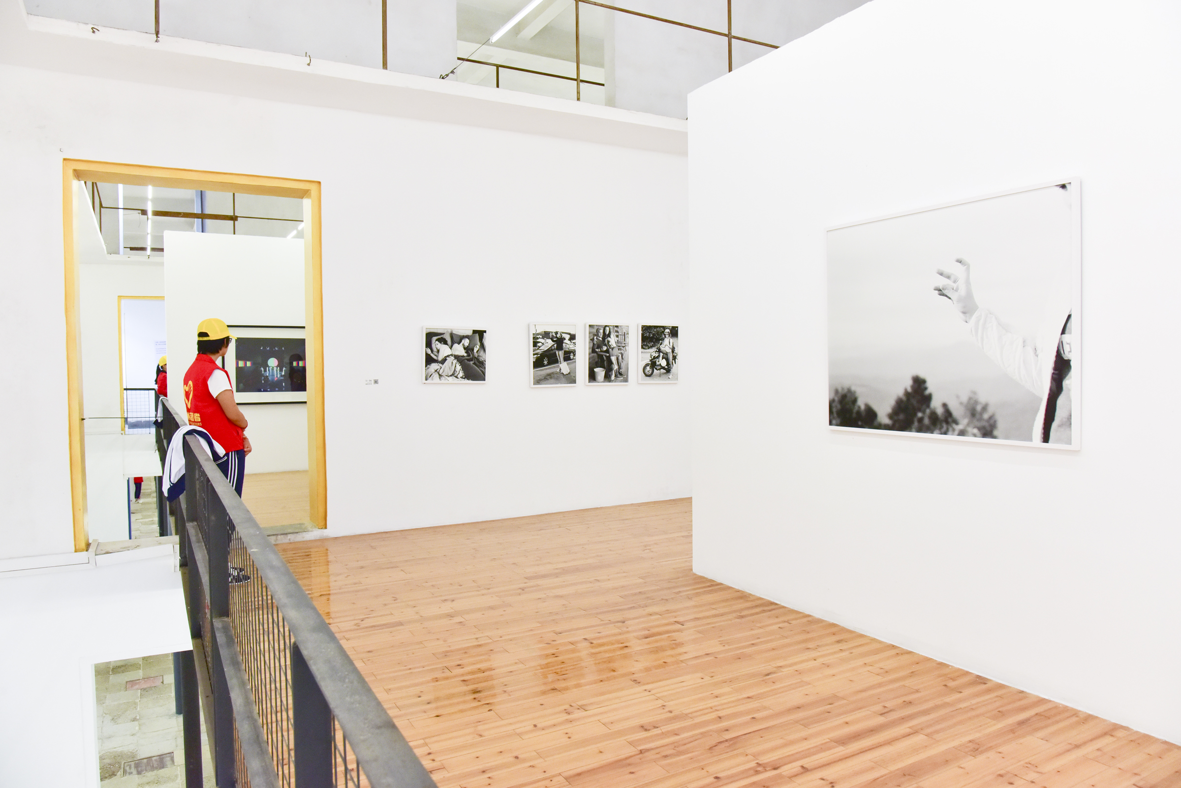  Installation photographs of Removed series by Eric Pickersgill at Lianzhou Foto Festival in Lianzhou, China 2016. Removed is a series of large format black and white photographs that are of individuals performing as if they are using thier devices a