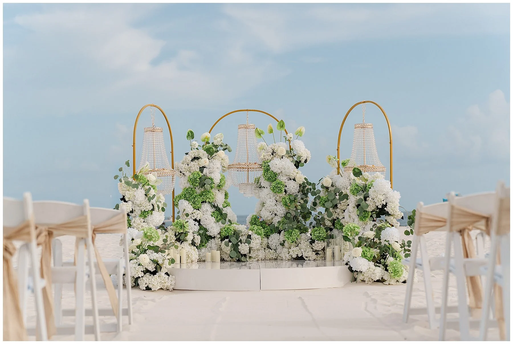 gulf-shores-wedding-chandelier-arch-white-hydrangea-altar.jpg
