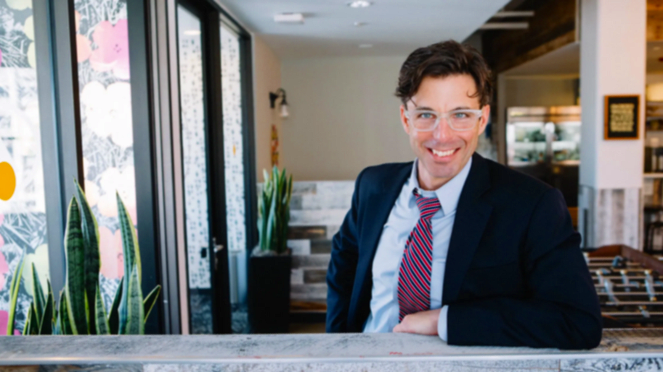 wework photo standing elbow glasses Zev-Hardman-1.png