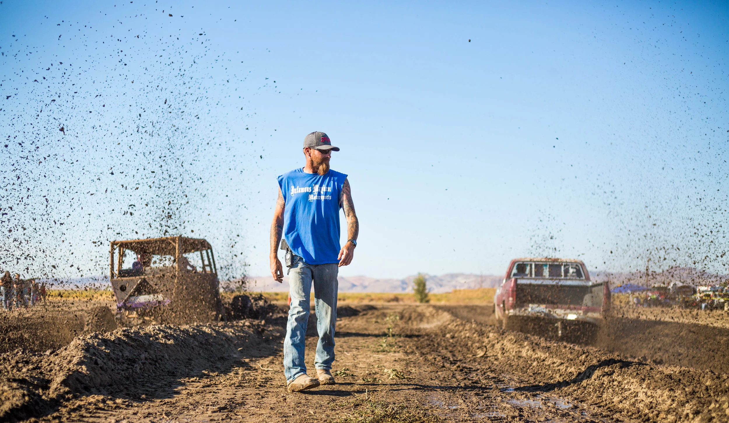 A Walker River Reservation local directs the annual mud drag races which attracts crowds from all over rural Nevada in early August.