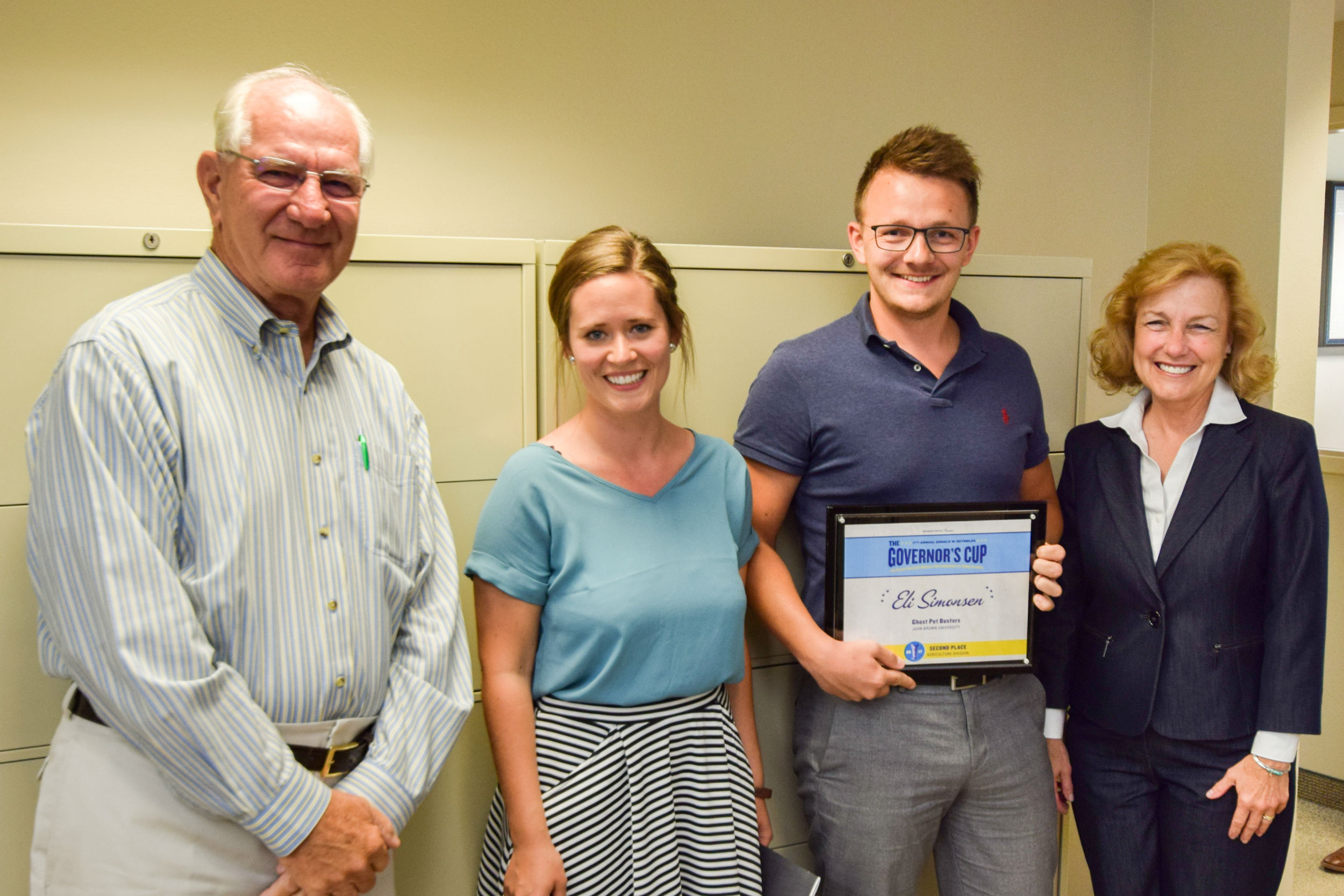 Pictured left to right; Mark Simmons, Simmons Foods Chairman, Kristina Arge Simonsen, Eli Simonsen, Simmons Prepared Foods Cost Accountant, Dr. Delia Haak, JBU Adjunct Instructor