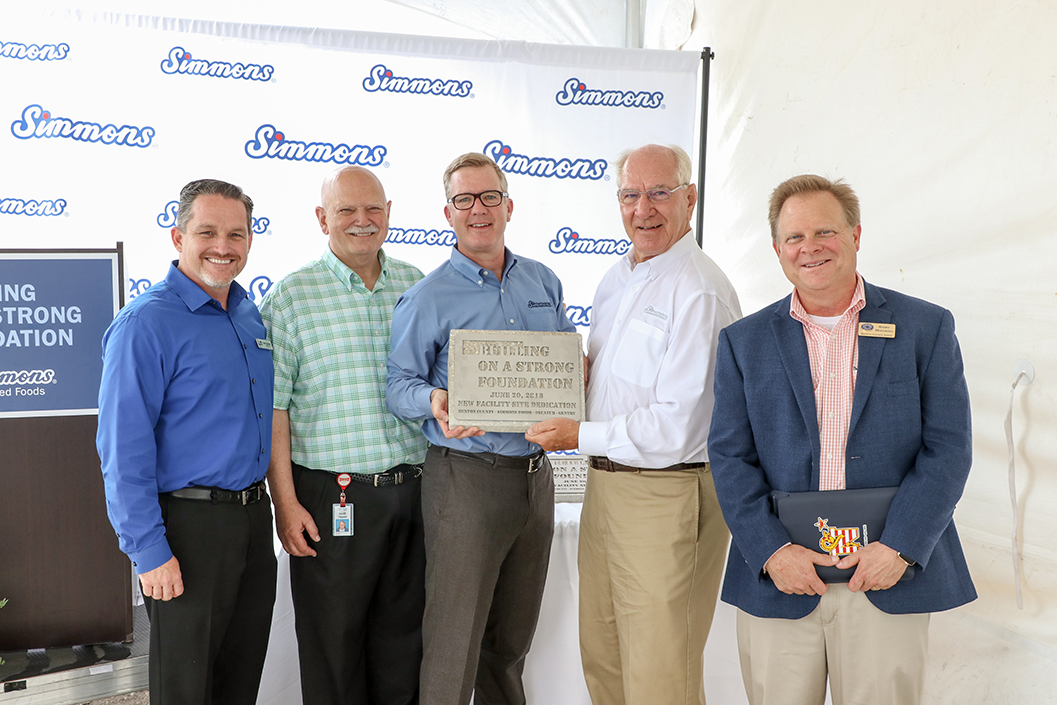 Pictured from left to right: Kevin Johnston, Mayor of Gentry; Bob Tharp, Mayor of Decatur; Todd Simmons, CEO and Vice Chairman, Simmons Foods; Mark Simmons, Chairman, Simmons Foods; and Judge Barry Moehring, Benton County.