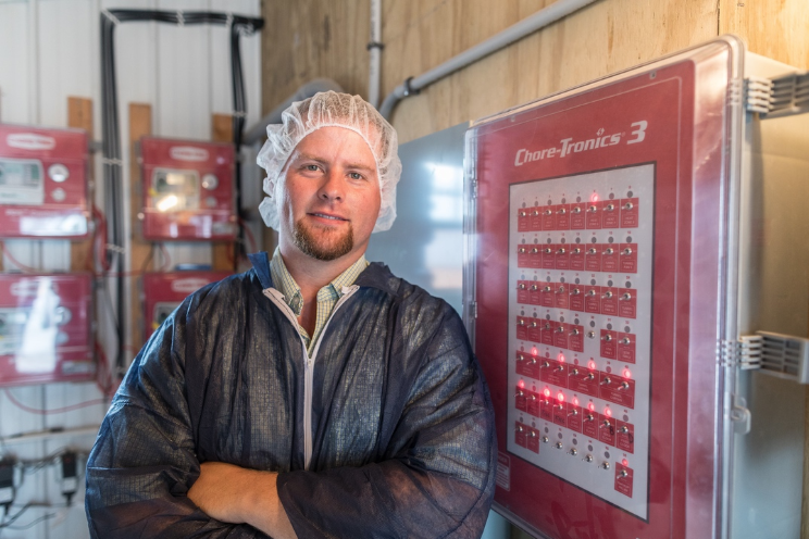 A Simmons Foods research farm manager provides an overview of a chicken house control room.