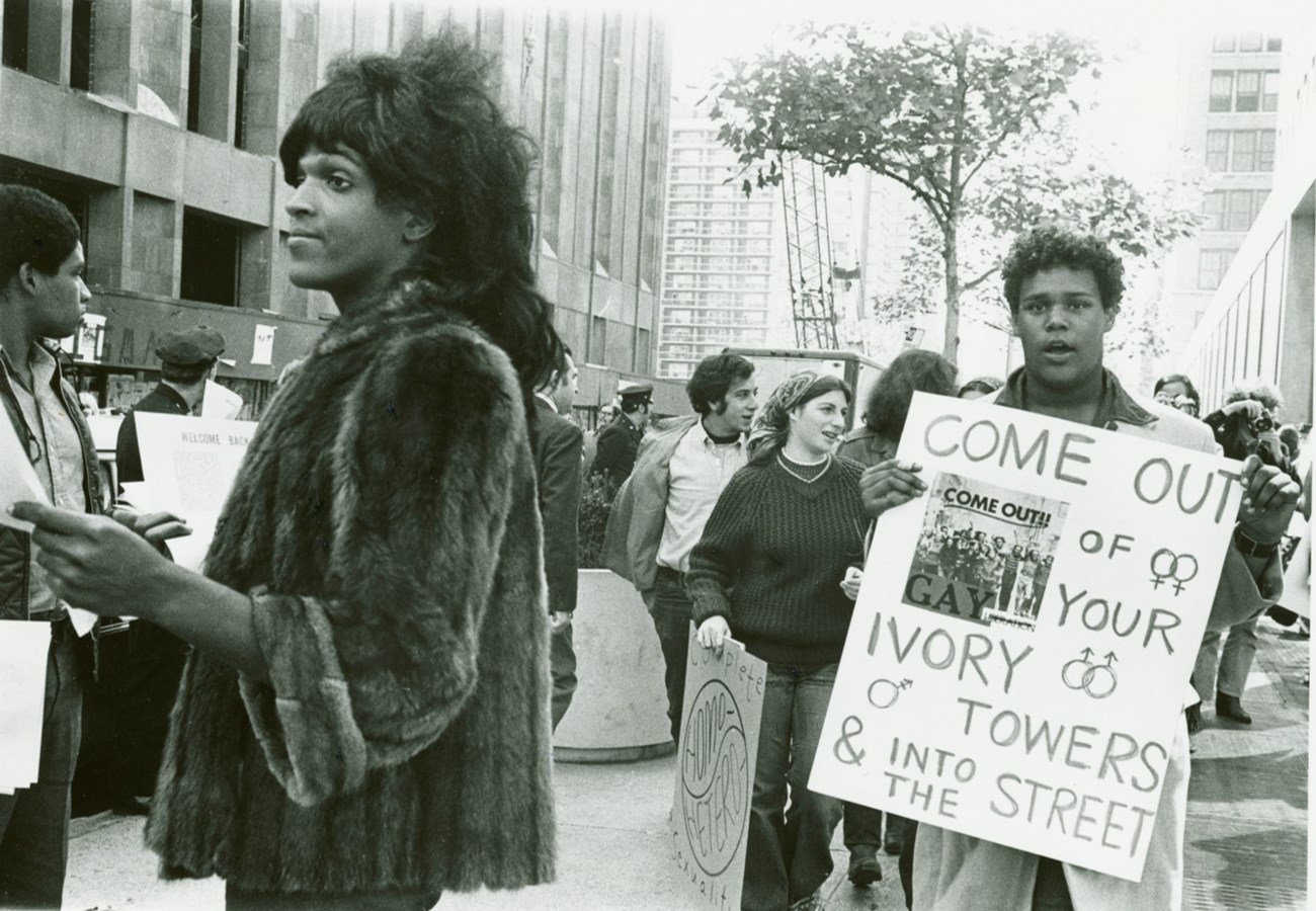 Marsha P. Johnson hands out flyers for support of gay students at NYU