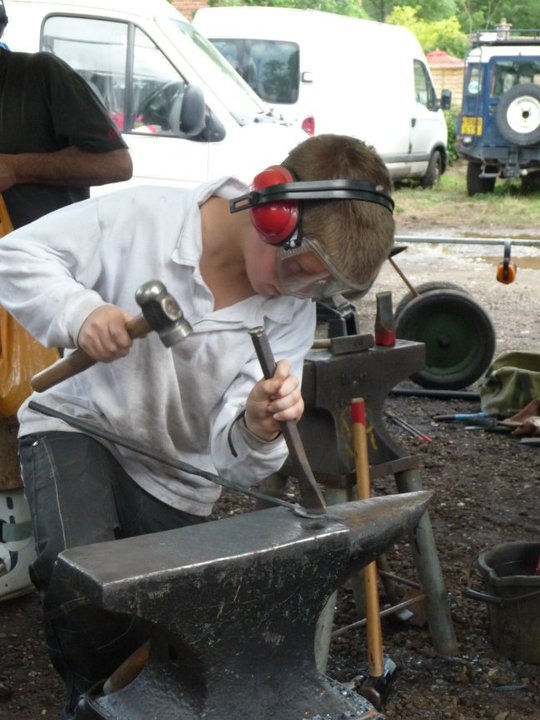 Me aged 11 or 12. Hammering away at a blacksmithing event! PPE game was strong!