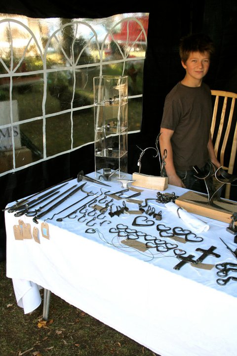 13 Year old me selling items at my first craft faire. I spent the entire summer holidays hammering away preparing for this, I sold £500 of my work at this event and was totally flabbergasted! I made every penny of that count, investing in more tools for the shop! Some you see in use today in my YouTube channel.