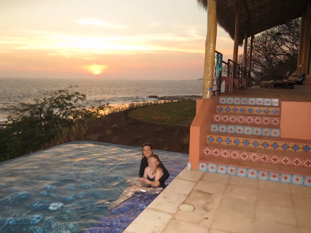 enjoying a dip in our beach-front infinity pool