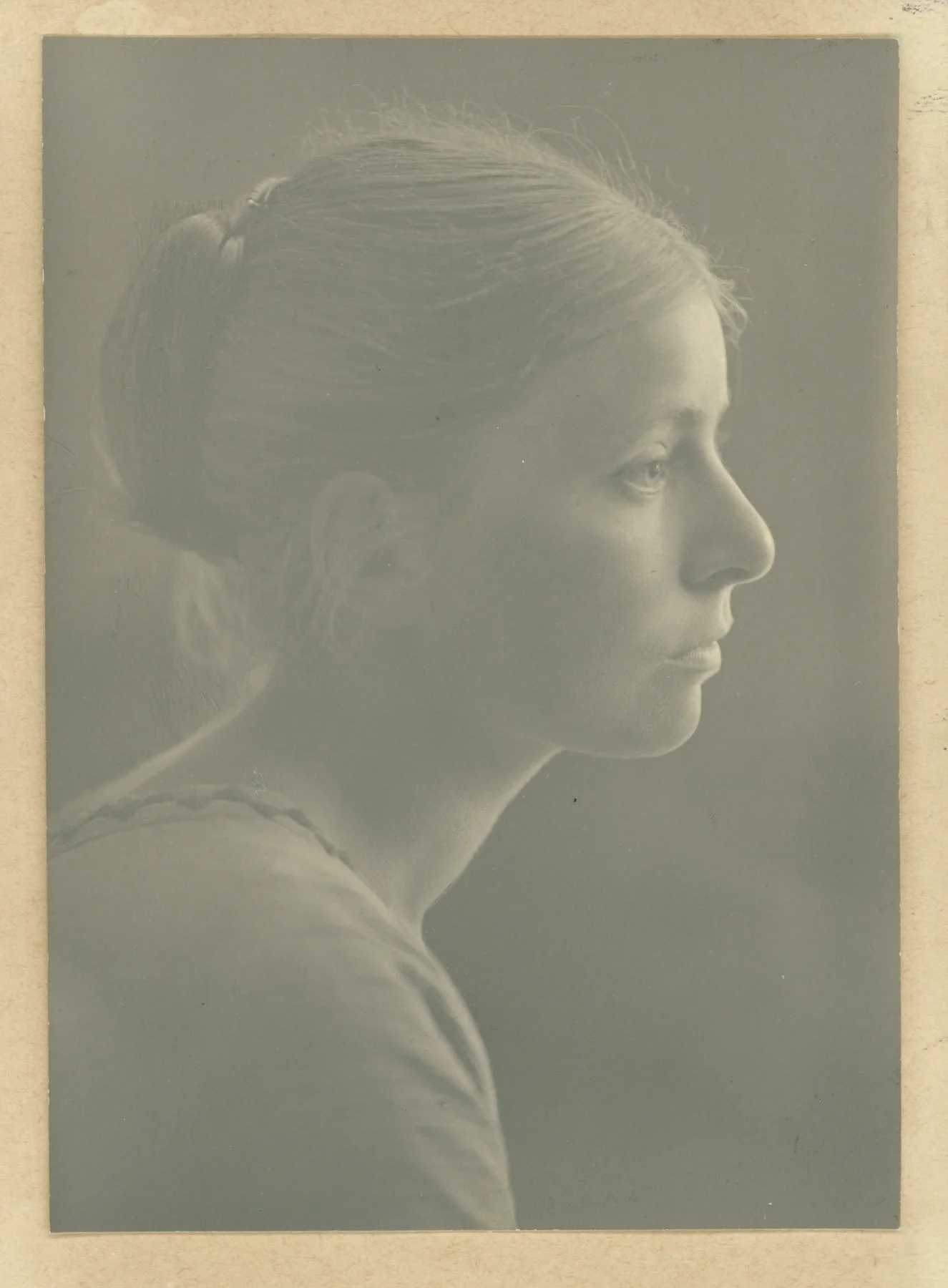 Scanned print has yellowed, faded and contains a number of scratches and damage