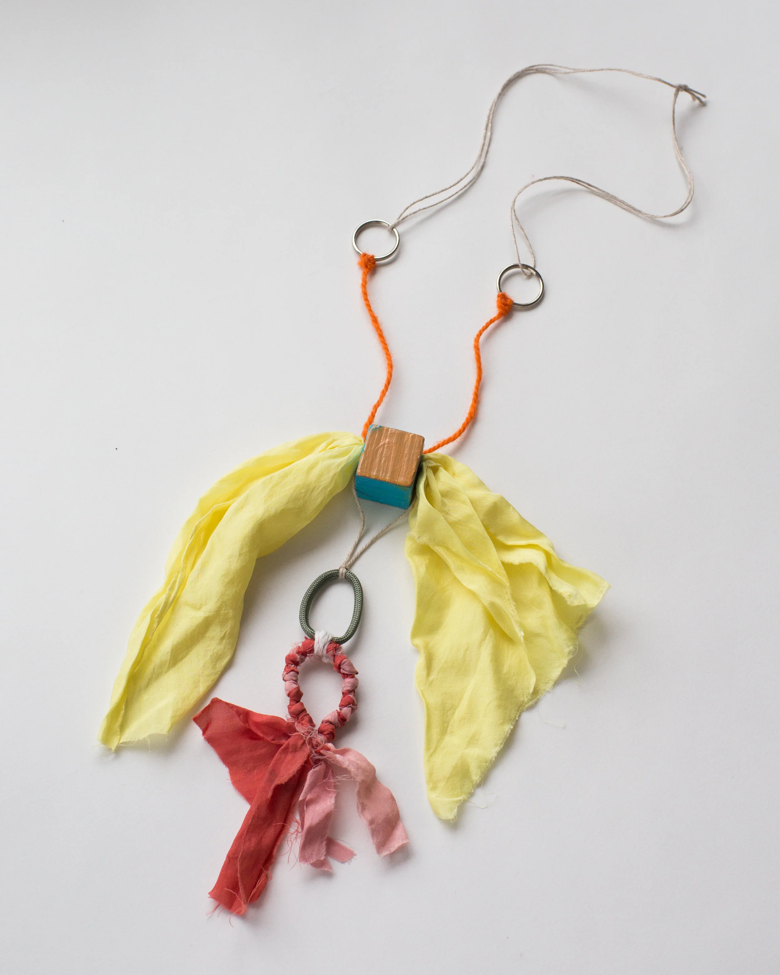   Ringring , Weld, Quebracho red, Lac, and madder on silk, key rings, linen, wool, wood, acrylic paint   