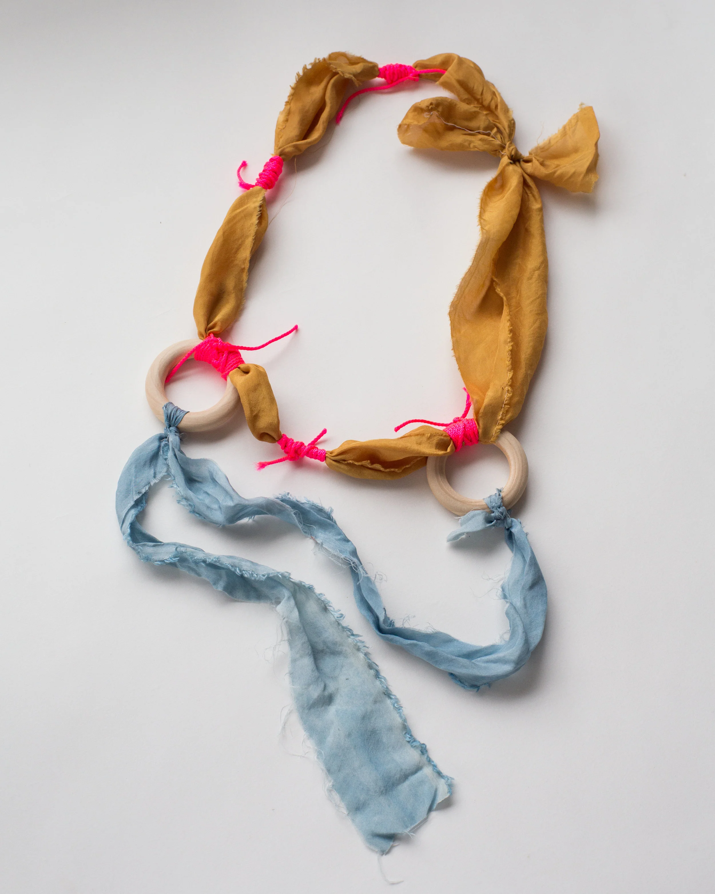   Four loops , osage orange and indigo on silk, mason twine, wood   