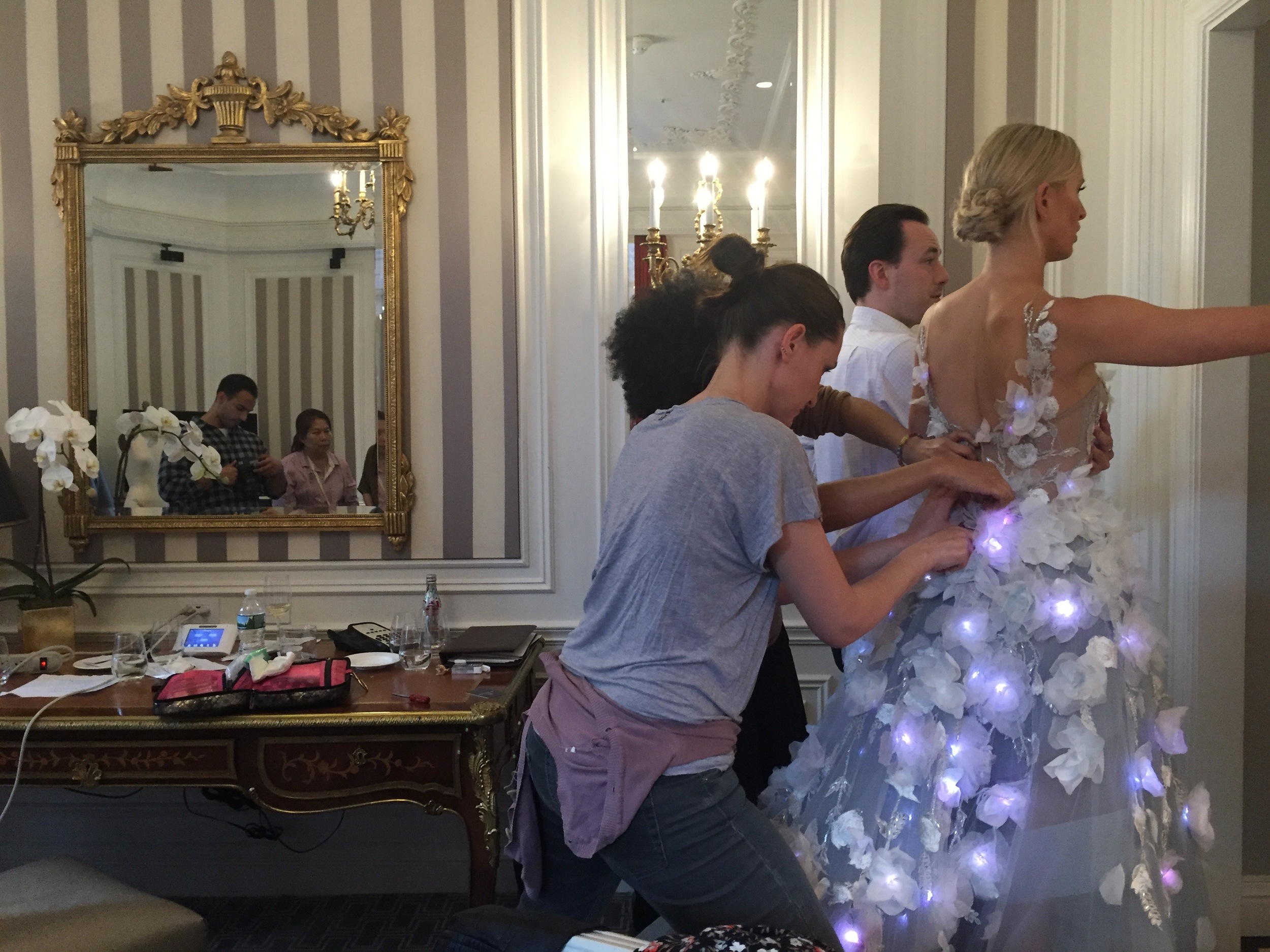 Karolina Kurkova rushes out of the hotel suite while we upload new code over the air