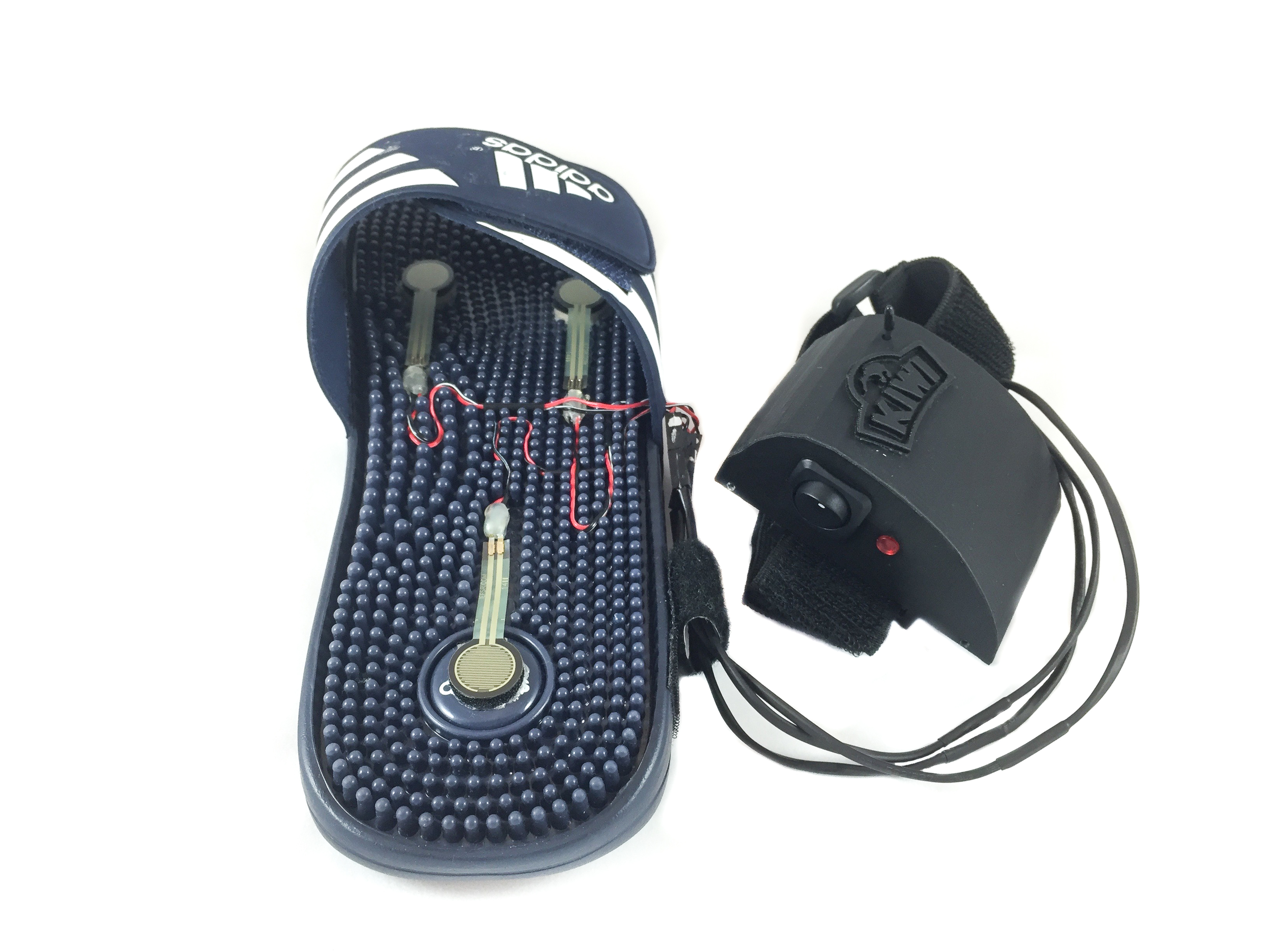 3 force sensors embedded in the sandal bed plug into a 3D printed device hub worn around the ankle.