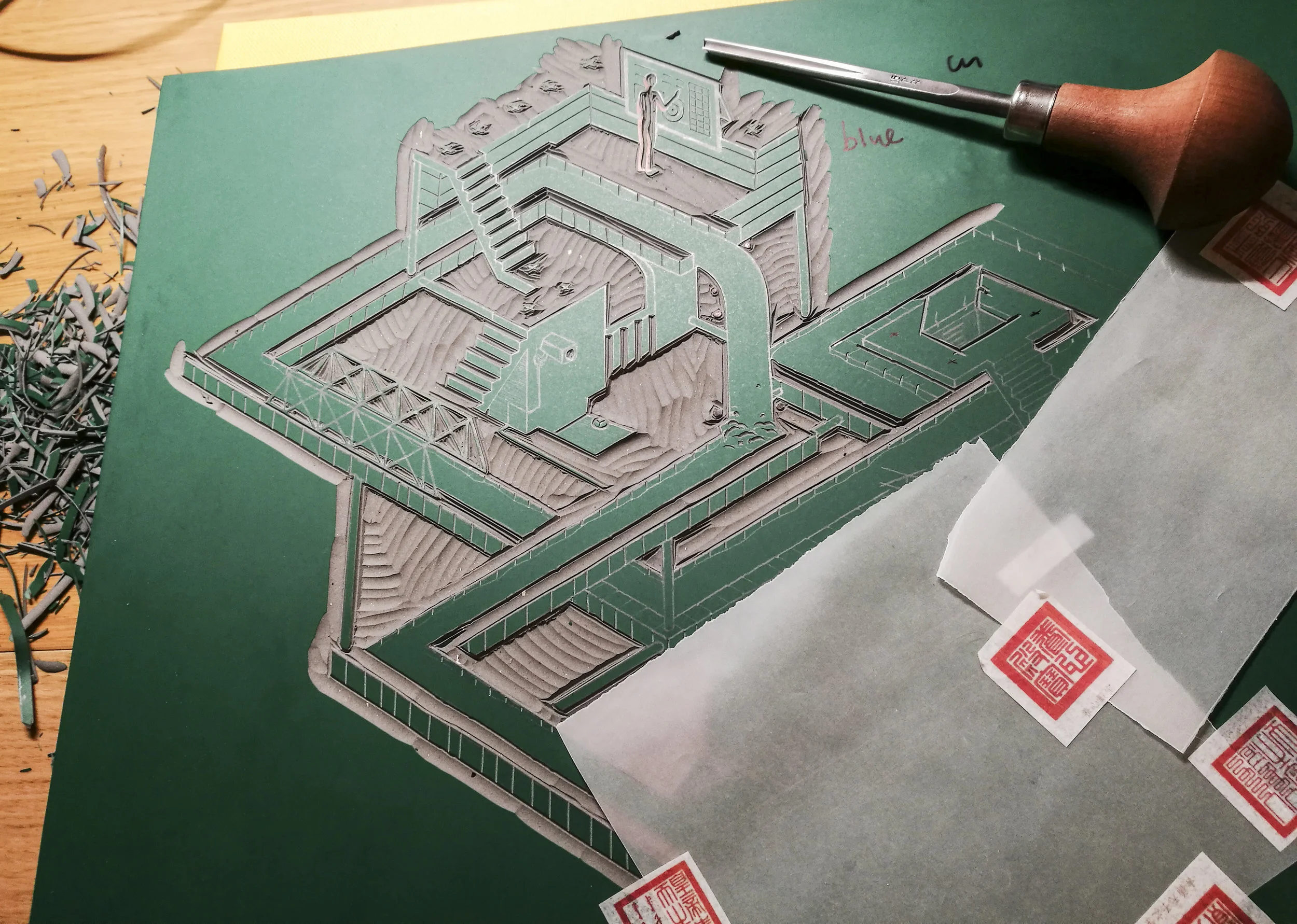 Carving the linoleum block.