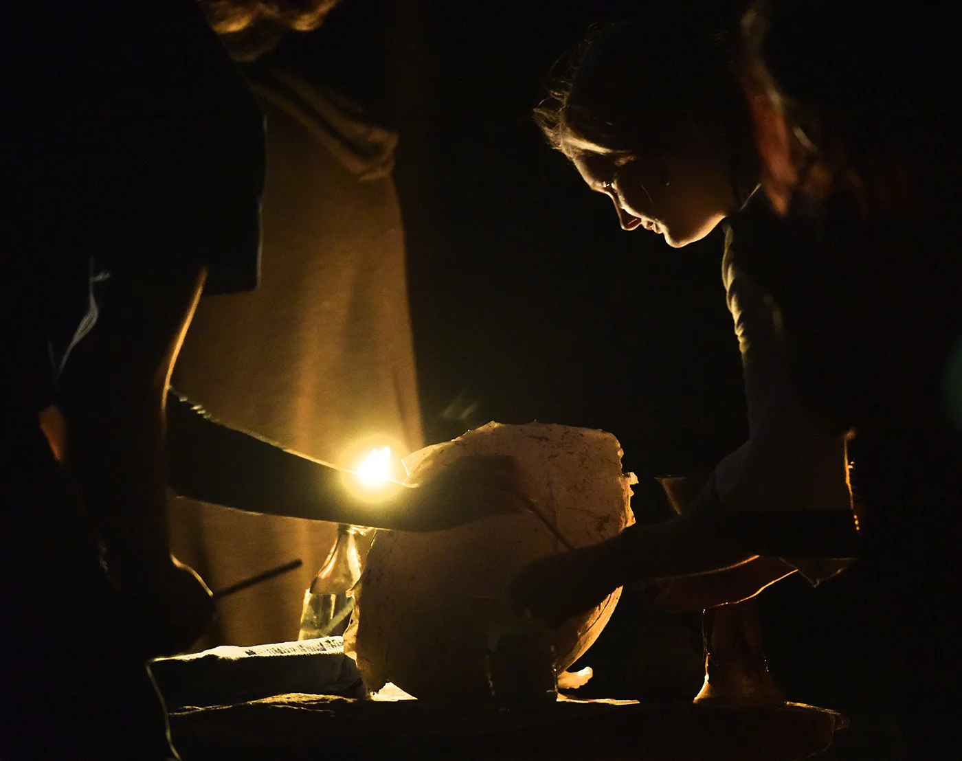 Clergy member Darcy Higgins leads a lunar gathering on Saturday, April 8, 2017. The April lunar gathering was the "egg moon," which is a reminder of the circle of life and fertility. It coincides with the Christian holiday of Easter. Higgins asked community members to write down their aspirations for the sanctuary and place it in the paper egg. The egg was then placed into the bonfire and danced around in hopes that their aspirations would come true.