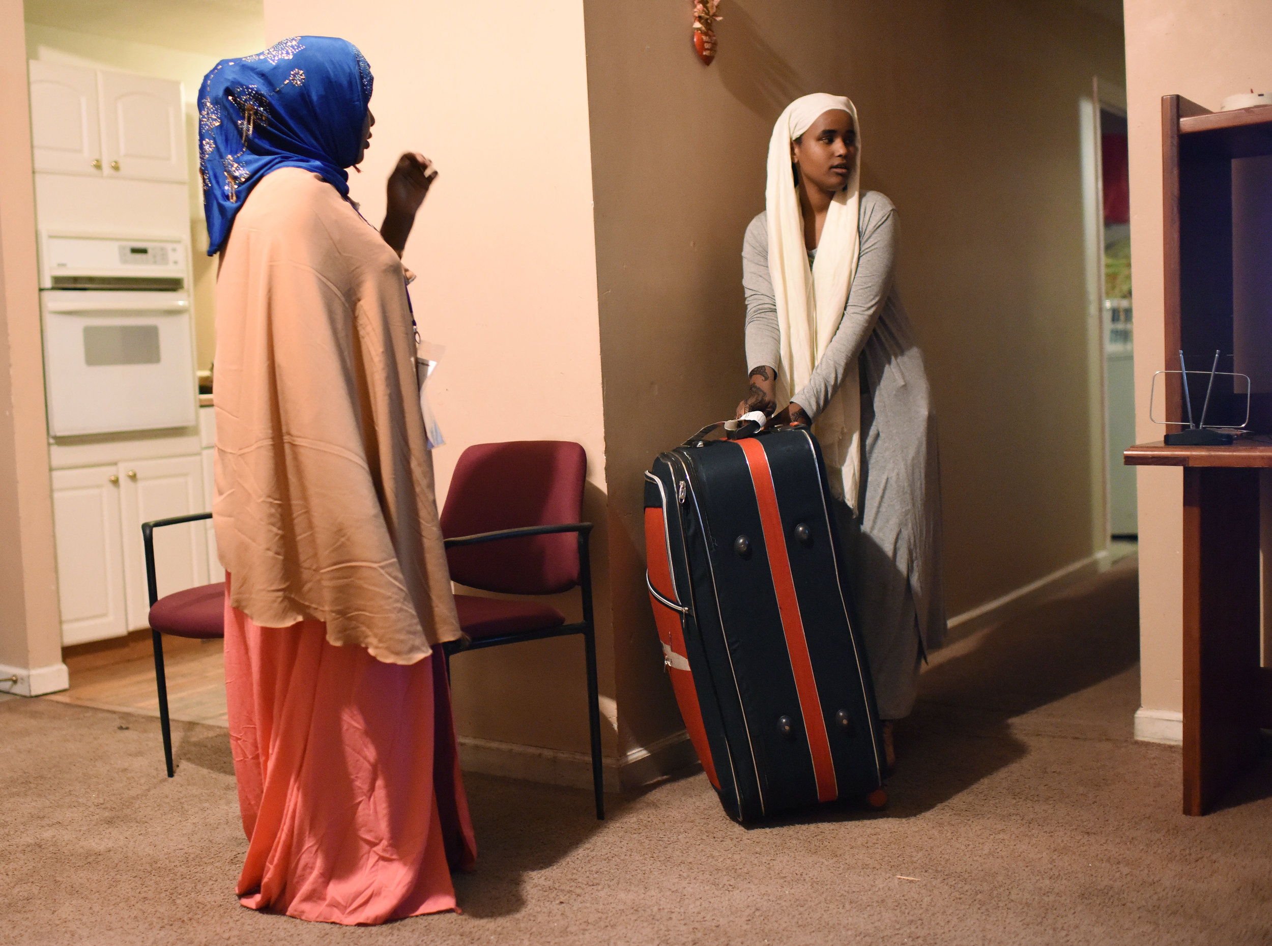 Kahd Hassan Barre and her daughter Iqro Abdirahman(cq) get settled into their new home on Friday, Feb. 17, 2017. Kahd came with five of her six children. The sixth child, Yasin Abdirahman, 16, had complications in the traveling process and was left in Africa. "I will not be happy until I see my son," Barre said. 