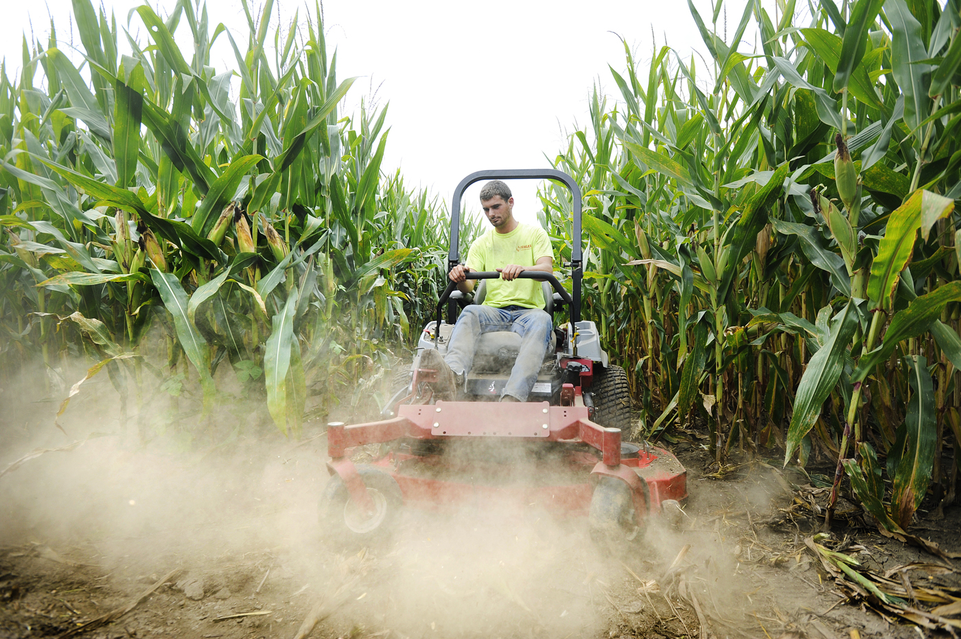 Dirt flies intot he air as Brody Rhodes mows in preparation for an upcoming event at the Fischer Farms corn maze near Noren River Acess on Monday, August 18, 2017. An eclipse crop circle corn maze will be open to the public Saturday, August 19 - Monday, August 21 in honor of the eclipse. 