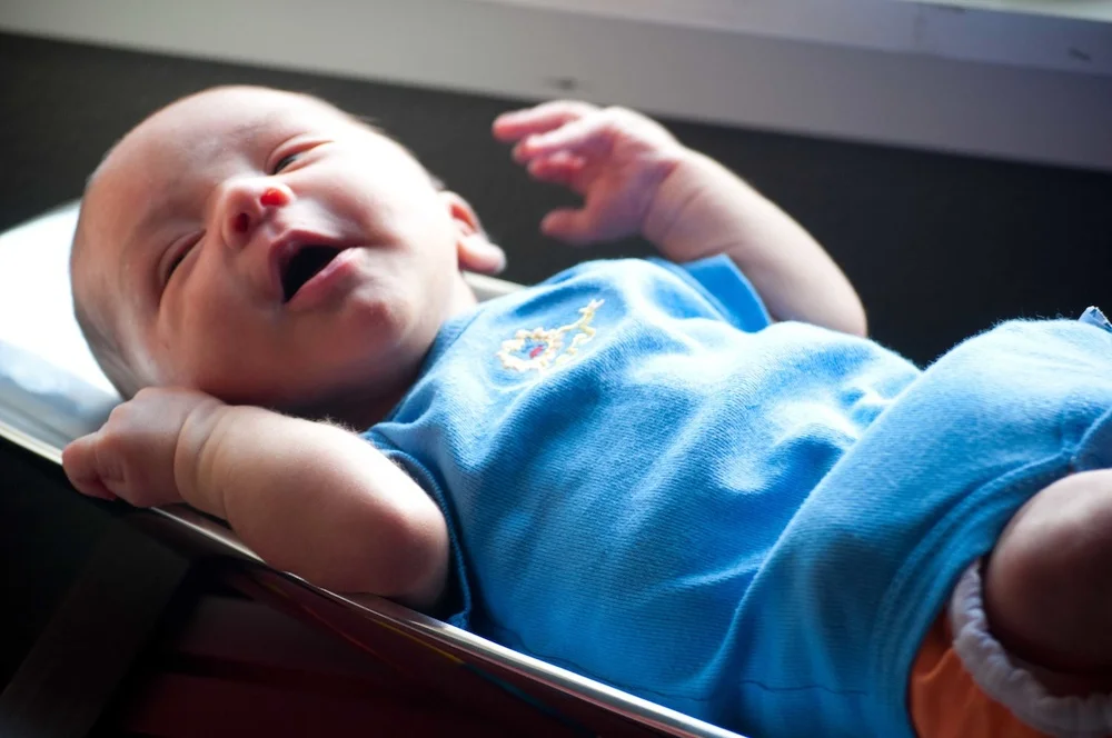 Dress that baby in SIMPLE clothes and colors -- no strips, dots, logos!