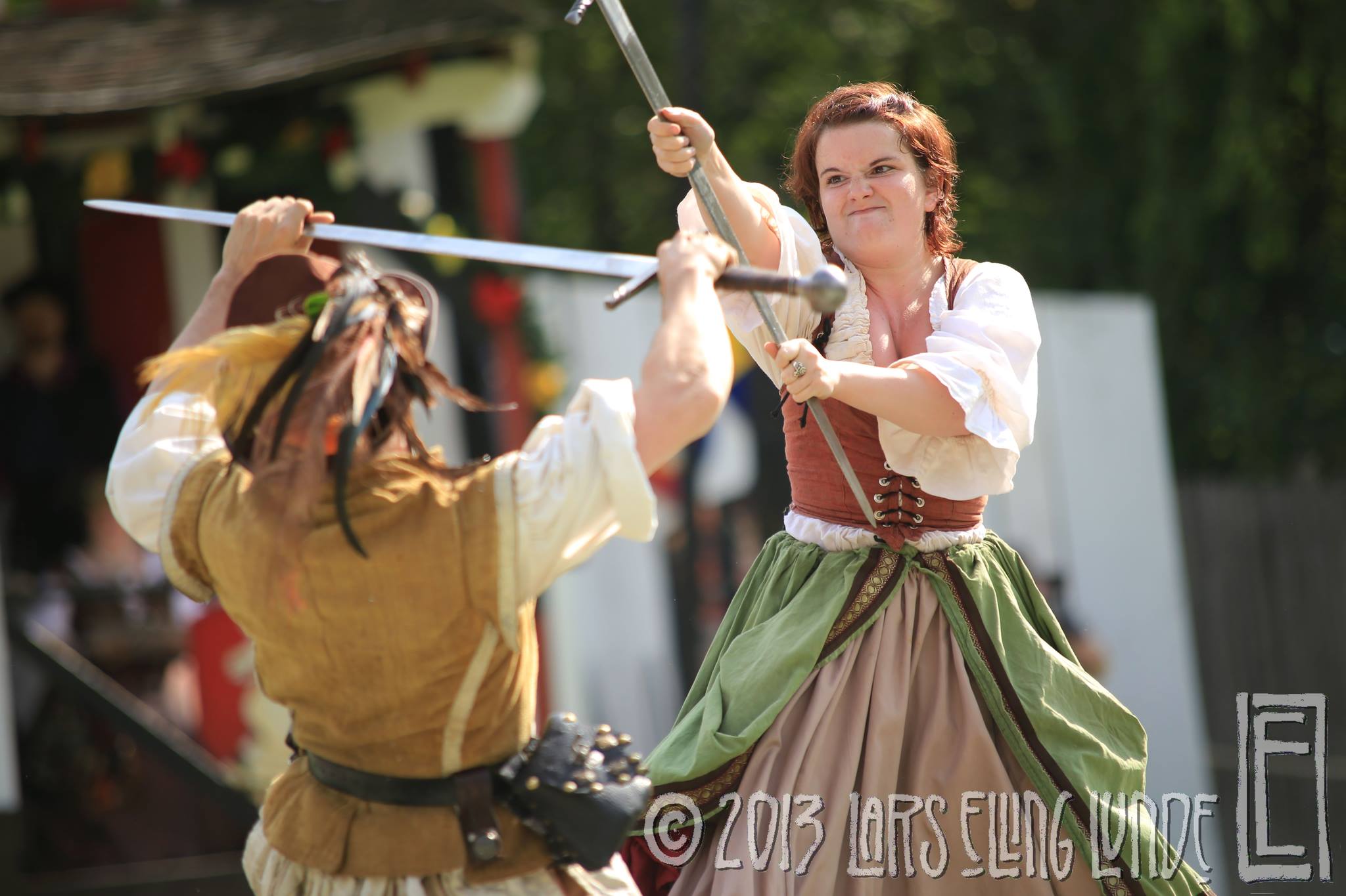 NYRF 2013, opening weekend - this fight was choreographed only two weeks beforehand and on my first day at the faire I performed it in front of hundreds of people (this was how I became known for broadsword fights - in three skirts, no less).