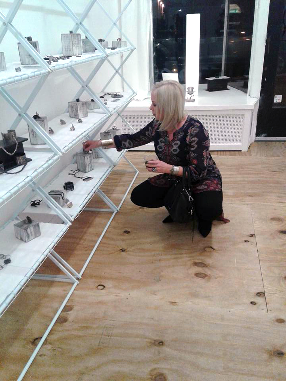 Adjusting jewelry at Gallery OVO.jpg