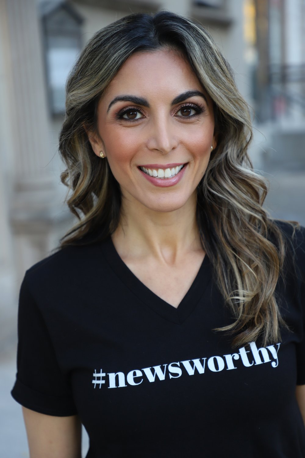 Ronica Cleary headshot t-shirt says newsworthy.JPG