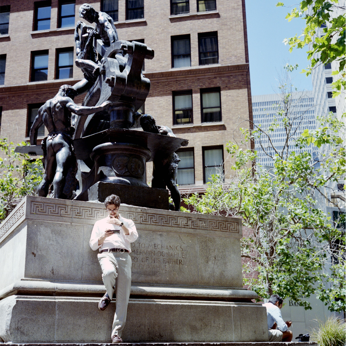 Man on a Phone Against Mechanics Monument