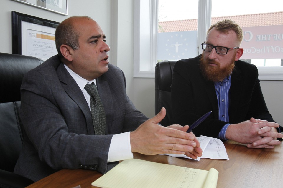 (left to right) Michael P. Pasquale , attorney; speaks as Lech Sierpowski of Bloomfield, former member of the US Marine Corps who fought in the Iraq War; listens to his remarks at the law offices of Michael P. Pasquale, LLC, in Montclair. Pasquale is representing Sierpowski in his struggle to attain greater veteran benefits. 04/28/2016 PPhoto by Jerry McCrea for NJ Advance Media
