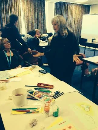 "I am Deaf, not dead." - Facilitating art therapy at the World Congress of the Sudden/Late Deafened for Stichting Plotsdoven, 2014. Photography courtesy of Hanske Kroon, the Netherlands.