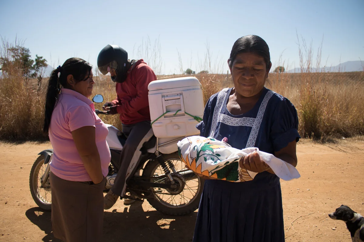 Herminia Vargas, left, 32, and her mother, Auria Vargas, right, 63 buy tortillas from a mobile vendor outside of their home in Zaachila, Mexico on Tuesday, Jan. 10, 2017.
