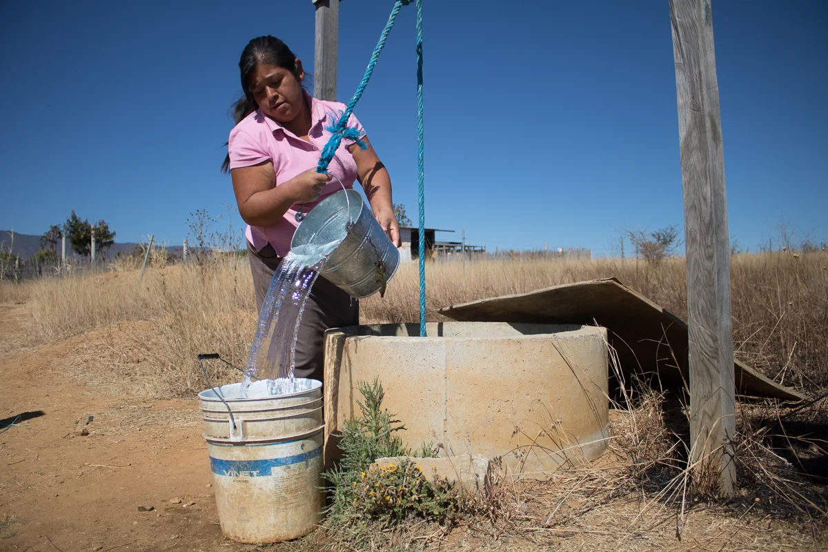 Herminia Vargas, 32, collects water from her family’s well in preparation to do laundry in Zaachila, Mexico on Tuesday, Jan. 10, 2017.