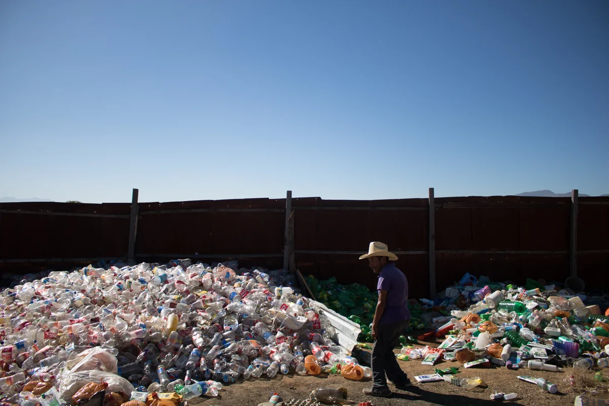 Eliseo Vargas, 35, stands near the pile of plastic he recently collected in Zaachila, Mexico on Friday, Jan. 13, 2017. Eliseo sells the recyclables to a nearby facility and the money he earns is the Vargas’s main source of income.