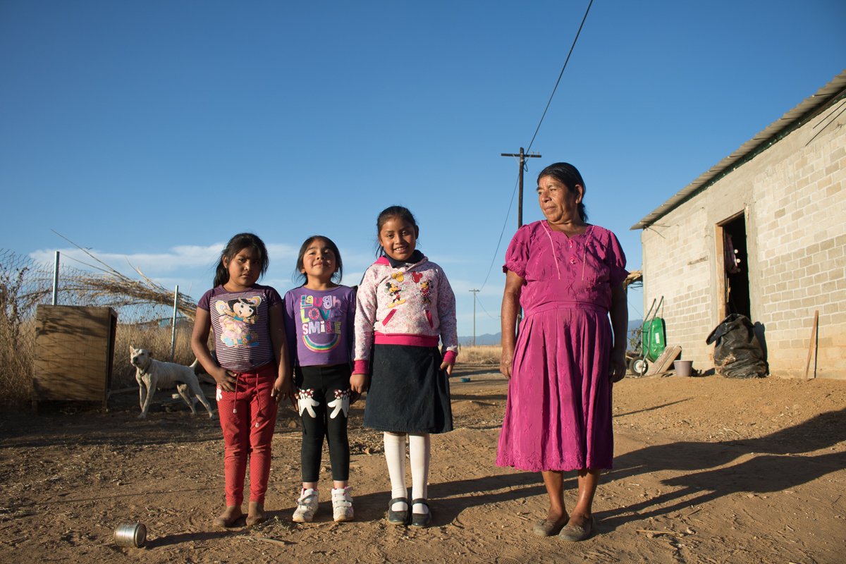 Auria Vargas, 63, watches her grandchildren outside of her family home in Zaachila, Mexico on Friday, Jan. 13, 2017.