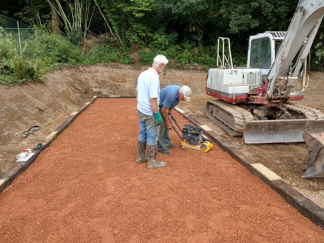 Packing down the layers of gravel