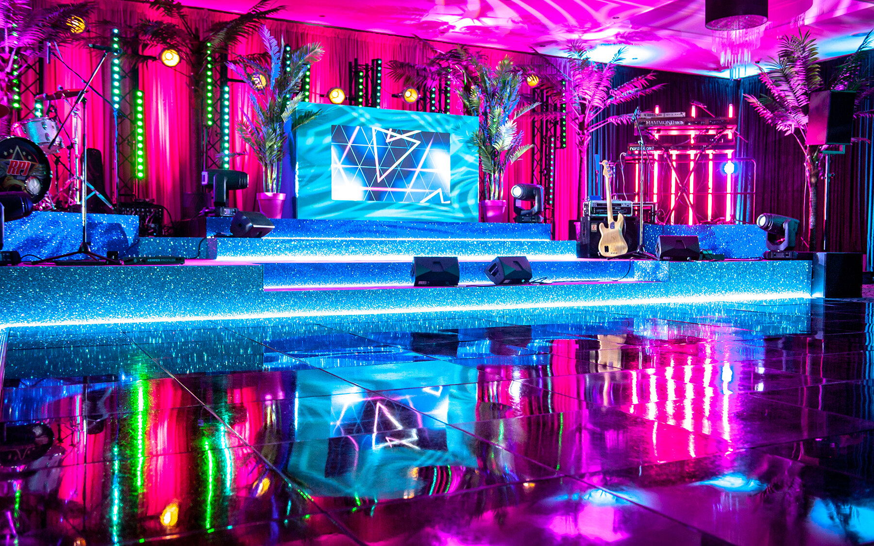 reveries-events-brighton-flowserve-crowne-plaza-hotel-rpjband-corporate-event-party-design-install-production-lighting-sound-staging-setdesign-draping-neon-dance-floor-entertainment-dj-booth-management-o.jpg