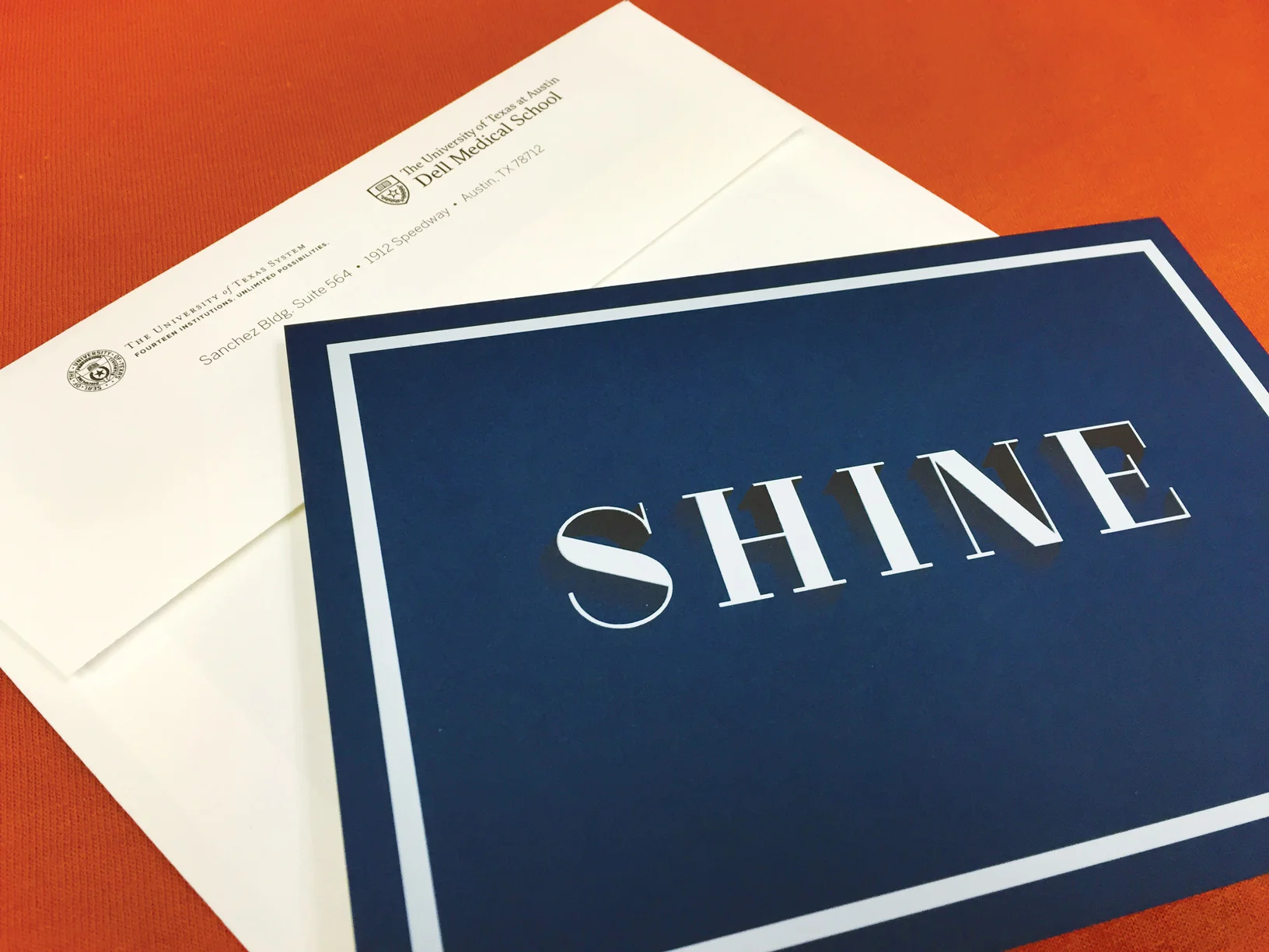 Design doesn't always have to be over thought. For this invitation, a simple design printed on blue stock using three hits of white ink did the trick. 