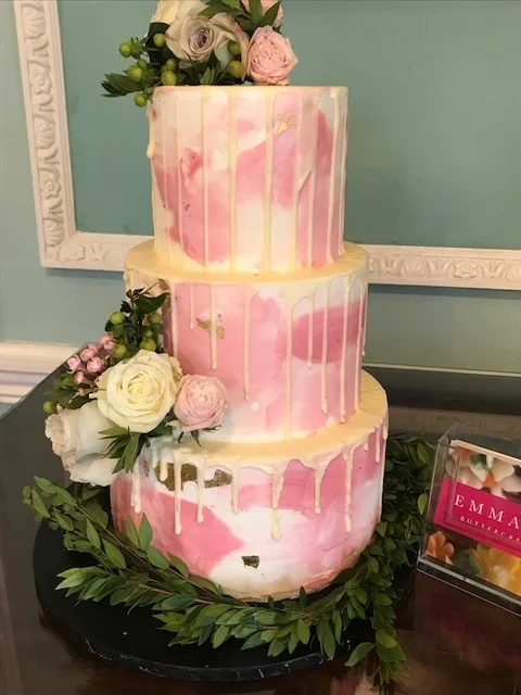 Buttercream water colour cake by Emma Page Buttercream Cakes London. The gold leaf and elegant flower sprays dress up this contemporary finish