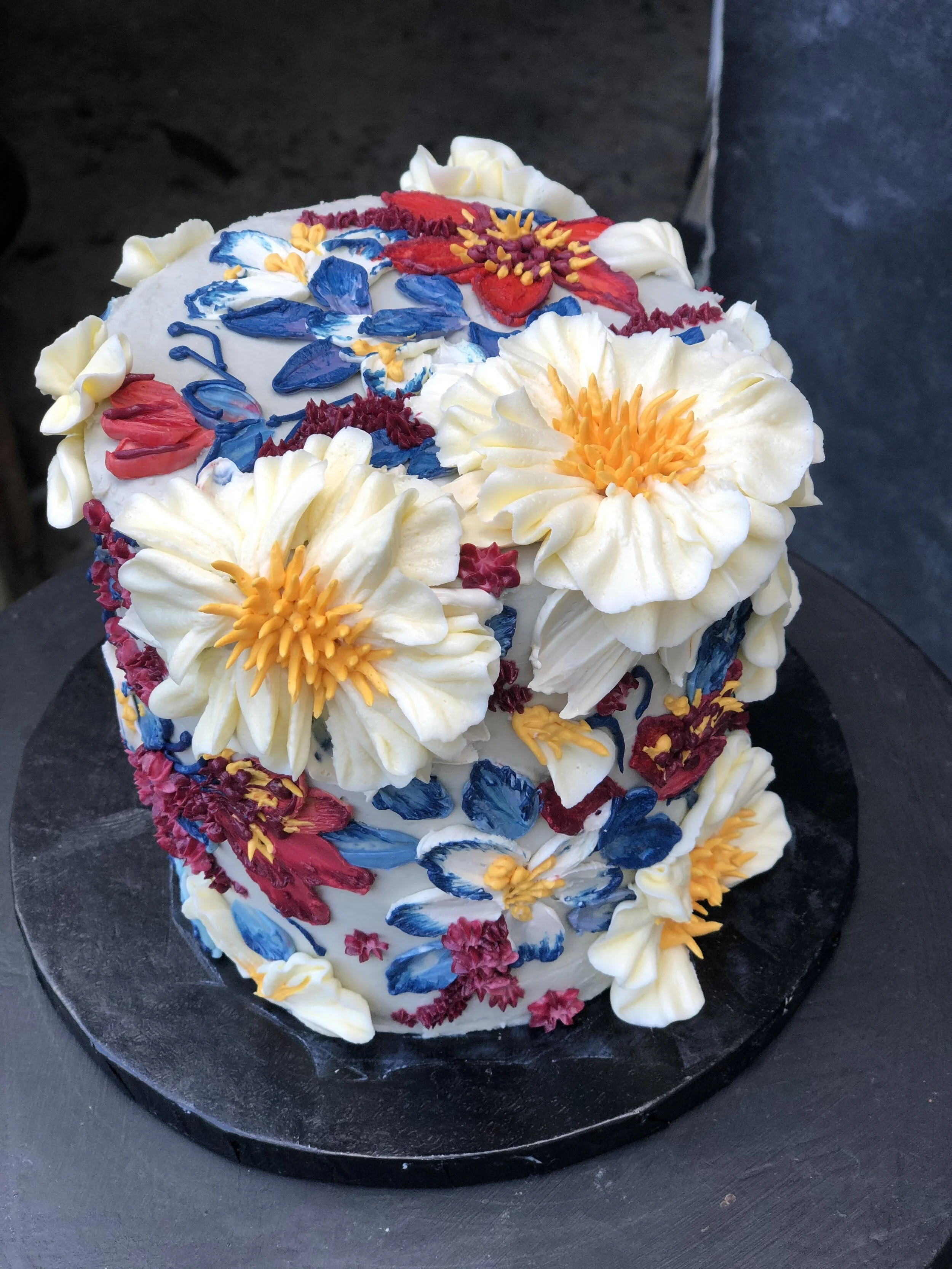 Single tier floral buttercream cake by Emma Page Buttercream Cakes London