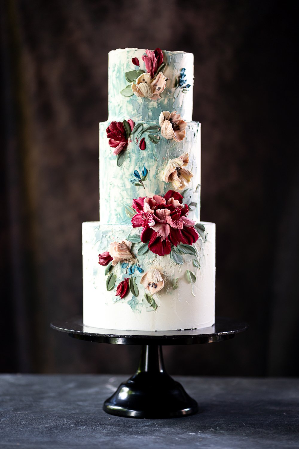Big Wedding Cake, Decorated With Buttercream Flowers, On The Grey Stone  Background Stock Photo, Picture and Royalty Free Image. Image 121473857.