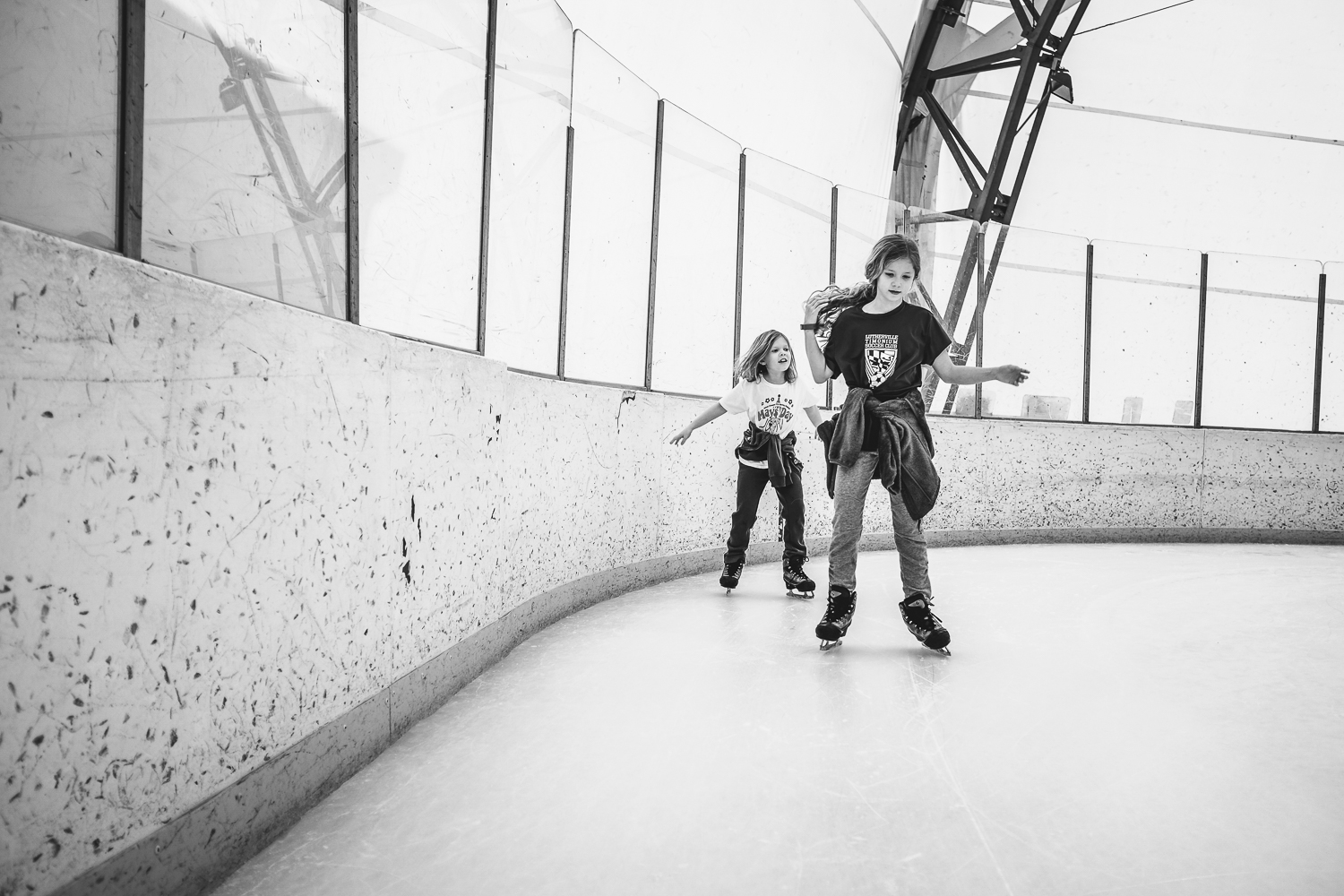 sisters roller skating at Patterson Park ice rink in Baltimore, MD