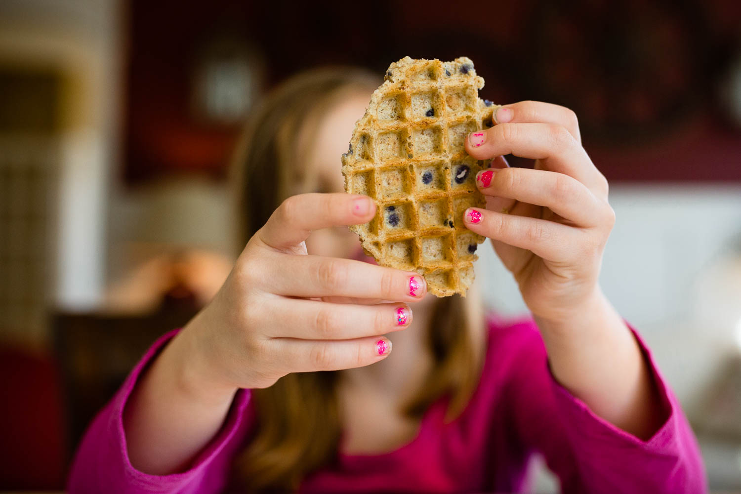 Girl holding a waffle.