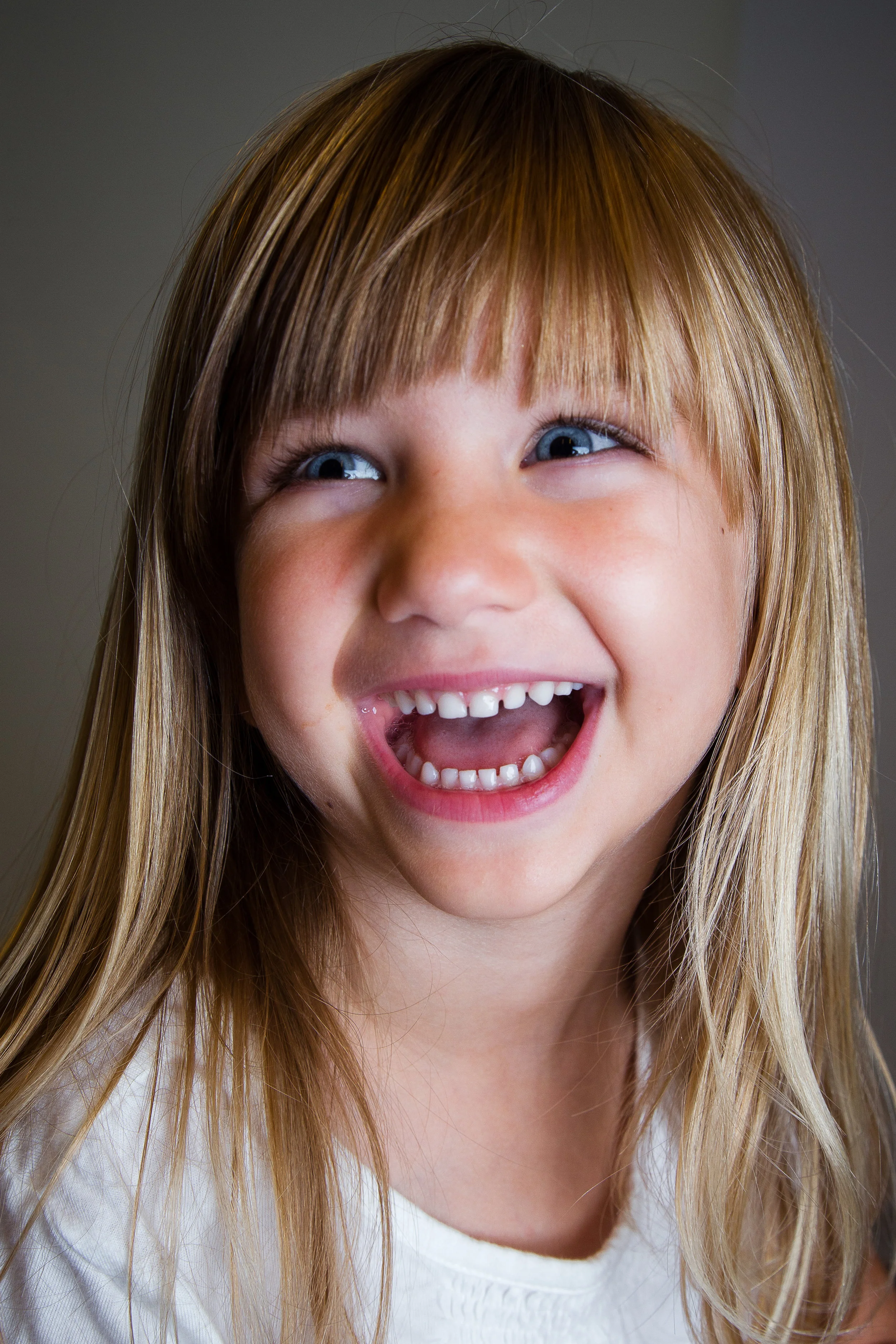 PRESCHOOLER WITH BANGS AND GIANT SMILE