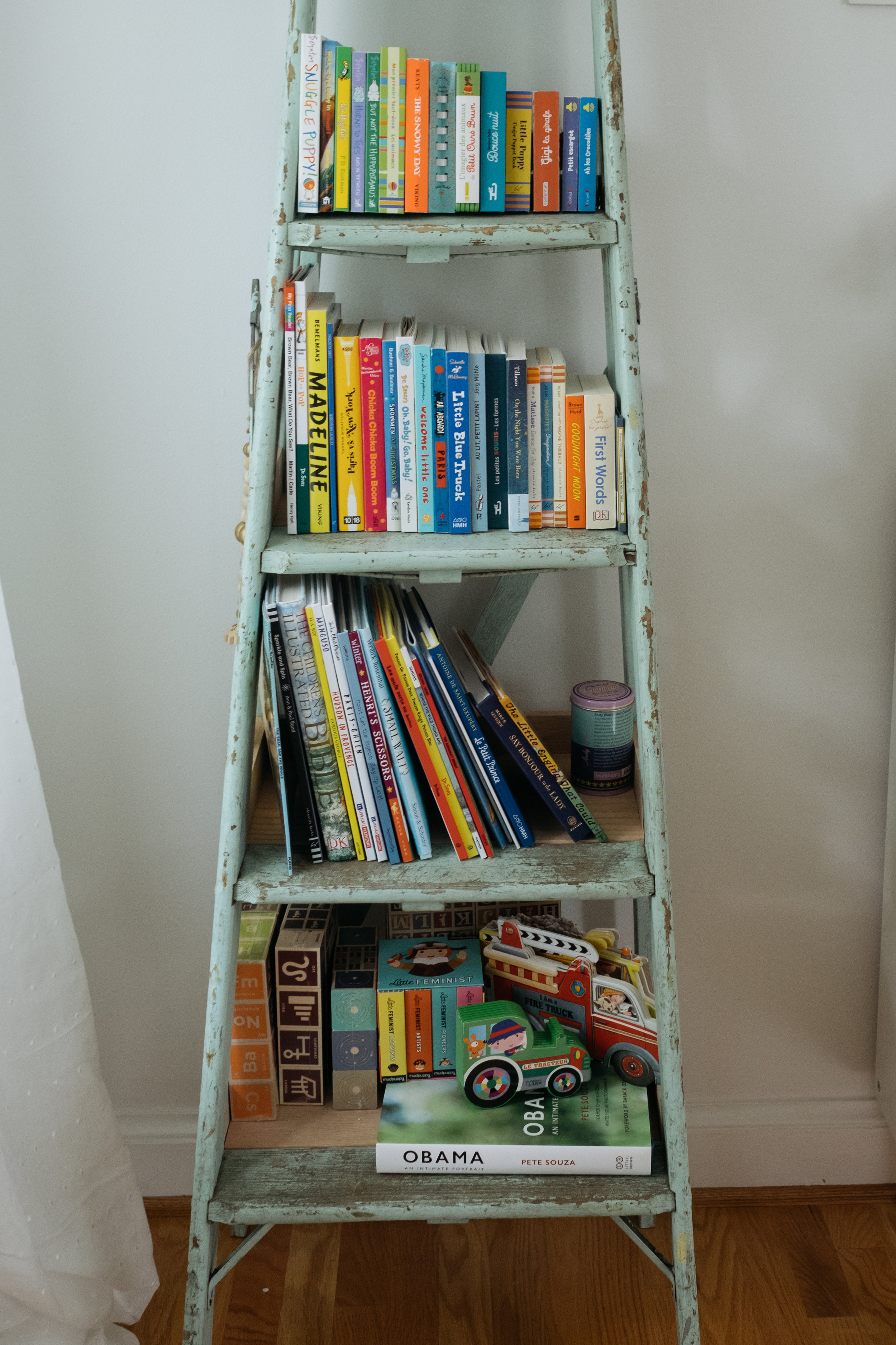 book display in corner of newborn's nursery