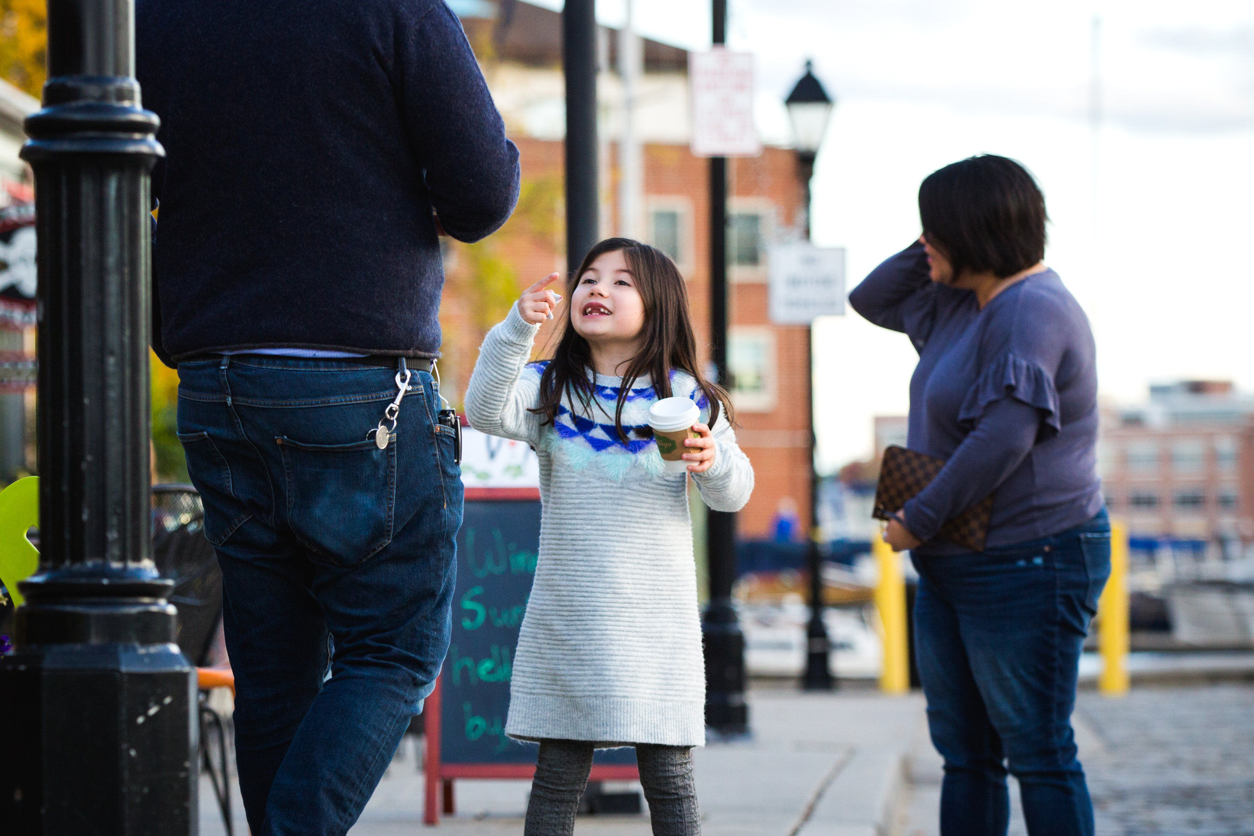 family gathers outside Italian cafe for snack in Baltimore