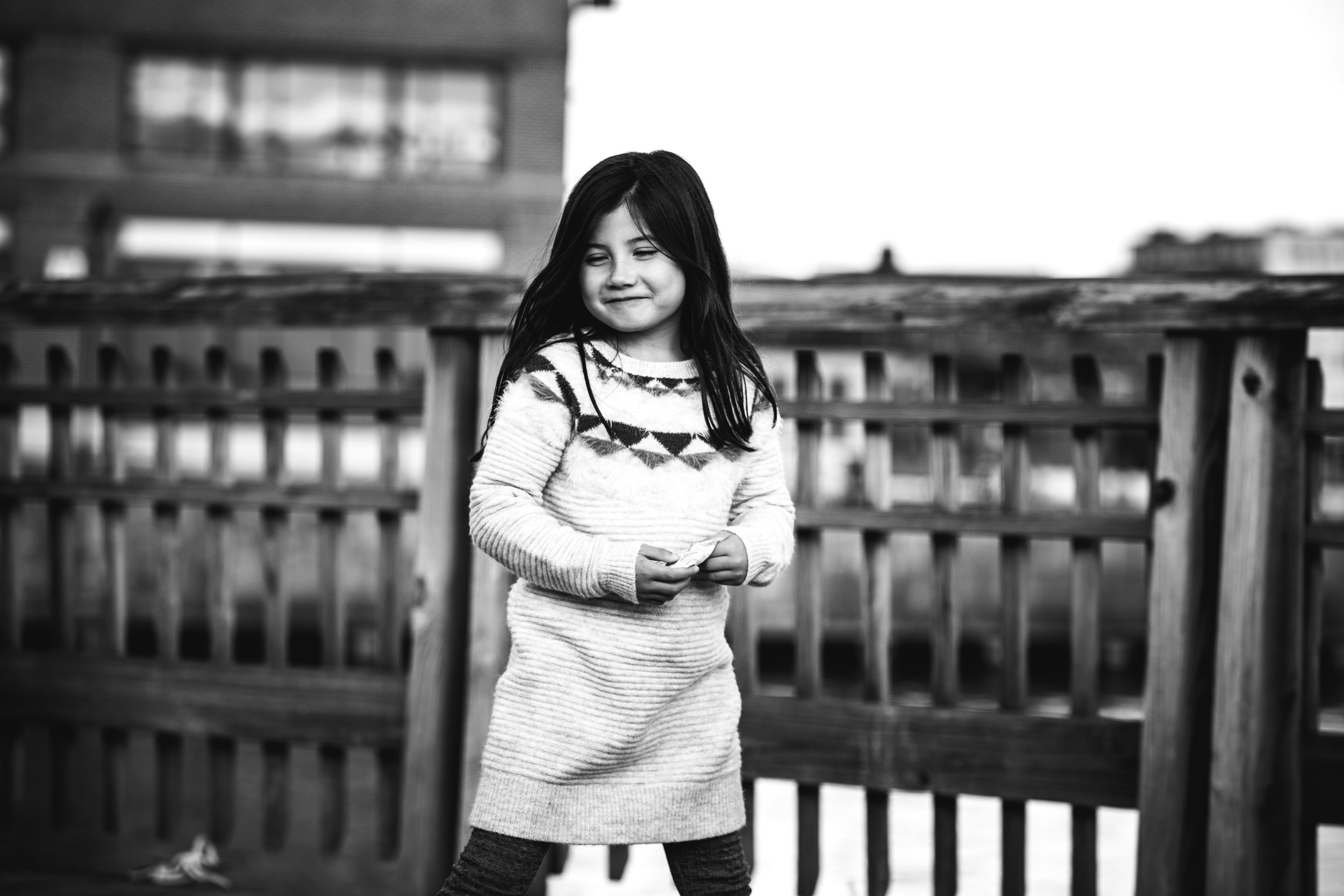 black and white photograph of sweet, smiling girl 